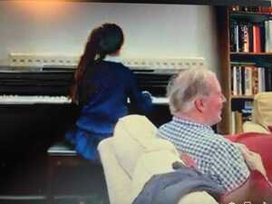 I don't have a good photo, but this is from a video of him (and all of us) listening and laughing as the piano played Mozart or something and India pretended to be a concert pianist. Happy days.